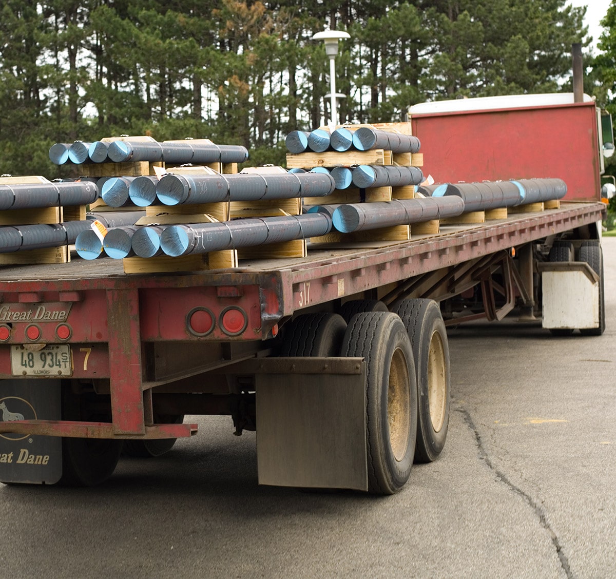 A truck delivering Iron rods to a remote location